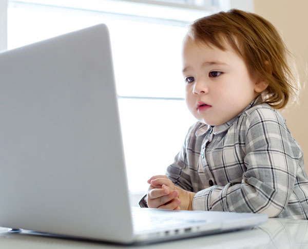 Child learning at home on the computer