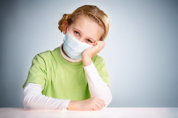 Young girl wearing mask during coronavirus pandemic